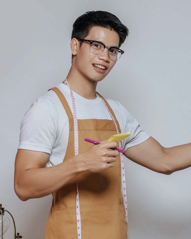 portrait-young-fashion-designer-man-working-in-stu-6ZF3RY5
