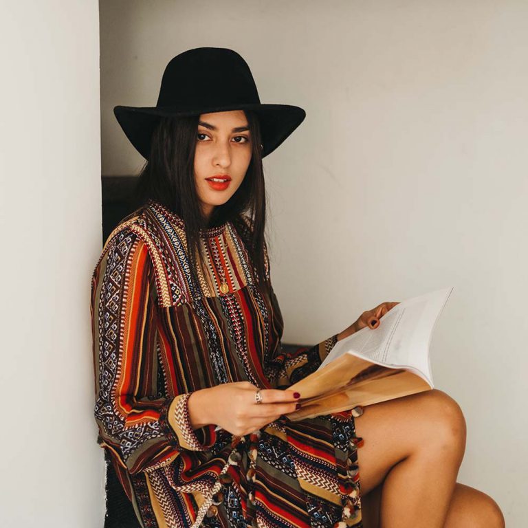 young-woman-with-fashion-magazine-NLSWZMX